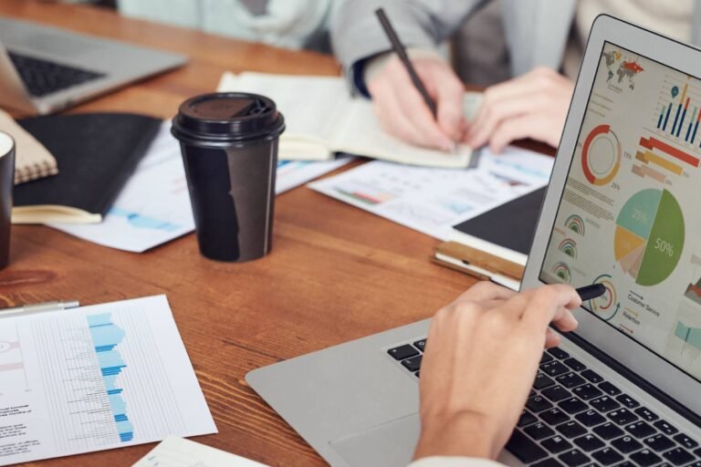 Reviewing sales data using a laptop